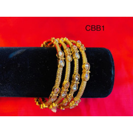 CBB1 - Gold bangles with uncut chocolate diamonds ..